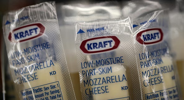Packages of Kraft mozzarella cheese are displayed on a grocery store shelf on February 22, 2019 Packages of Kraft mozzarella cheese are displayed on a grocery store shelf on February 22, 2019