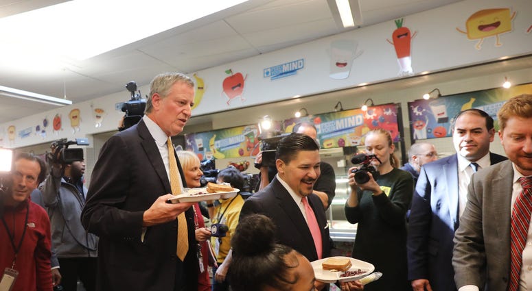 New York Mayor Bill de Blasio joins Schools Chancellor Richard Carranza and school children for lunch at PS130. Chancellor Richard Carranza
