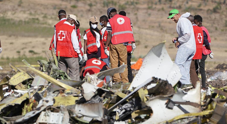 Forensics investigators and recovery teams collect personal effects and other materials from the crash site of Ethiopian Airlines Flight ET 302 on March 12, 2019 in Bishoftu, Ethiopia. Forensics investigators and recovery teams collect personal effects and other materials from the crash site of Ethiopian Airlines Flight ET 302 on March 12, 2019 in Bishoftu, Ethiopia.