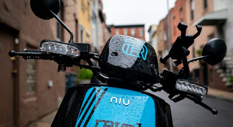 A Revel brand moped sits parked on a residential street, June 18, 2019 in the Brooklyn borough of New York City.