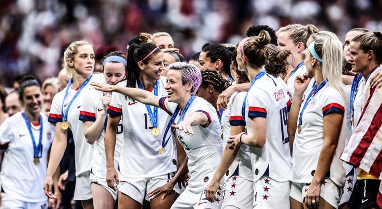 Megan Rapinoe of the USA celebrates with team mates following her team's victory in the 2019 FIFA Women's World Cup France Final match between The United States of America and The Netherlands Megan Rapinoe of the USA celebrates with team mates following her team's victory in the 2019 FIFA Women's World Cup France Final match between The United States of America and The Netherlands