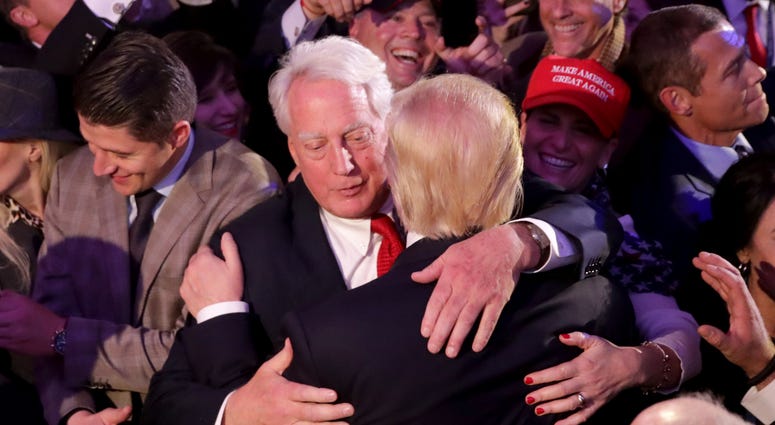 Republican president-elect Donald Trump (R) hugs his brother Robert Trump after delivering his acceptance speech at the New York Hilton Midtown in the early morning hours of November 9, 2016 in New York City. Robert Trump
