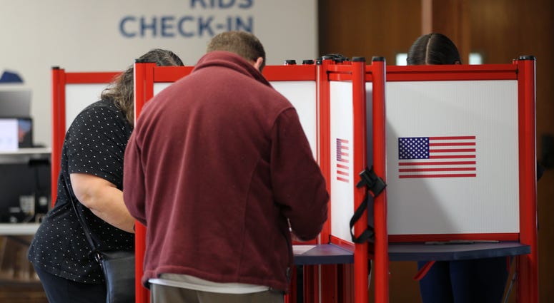 Voters cast ballots on election night 2019 Voters cast ballots on election day 2019
