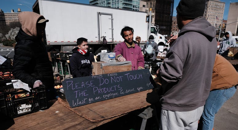 People shop in a farmers market on a spring day in Prospect Park on March 21, 2020 in the Brooklyn borough of New York City. Coronavirus NYC