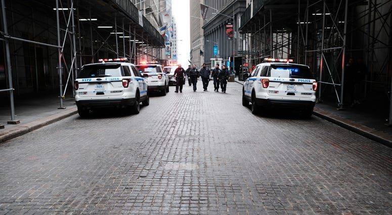 Police walk along Wall Street on March 20, 2020 in New York City. Coronavirus NYC