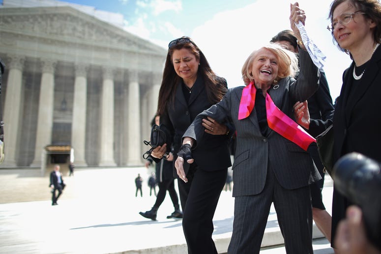 Edith Windsor (C), 83, acknowledges her supporters as she leaves the Supreme Court March 27, 2013 in Washington, DC. (Photo by Chip Somodevilla/Getty Images)