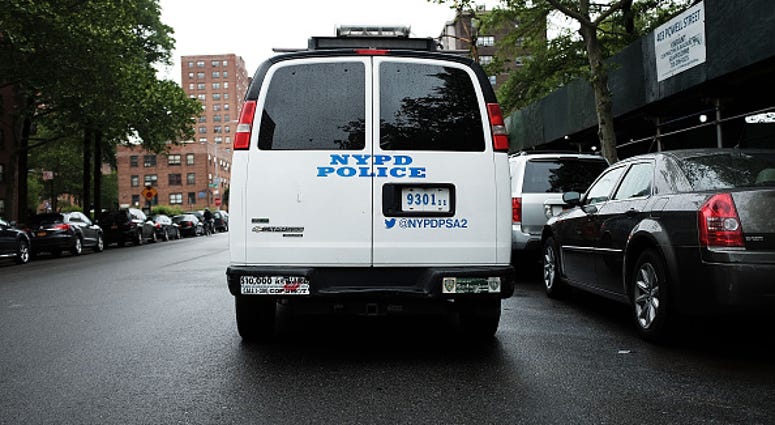 A New York City Police Department (NYPD) van is parked near housing projects in the Brownsville section of Brooklyn NYPD in Brownsville