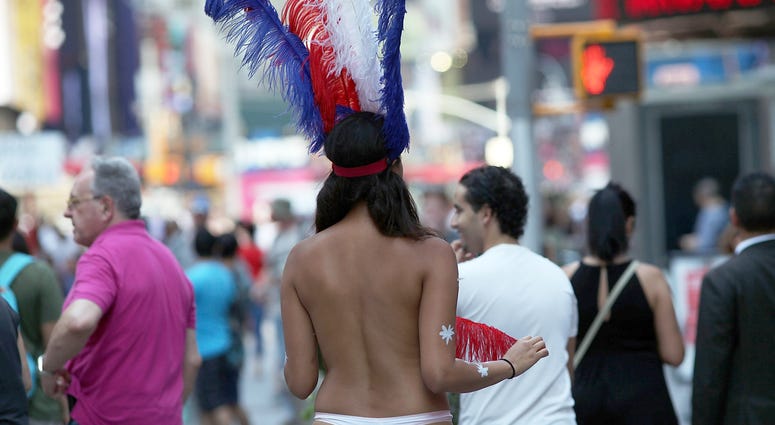 File photo Times Square topless performer desnuda