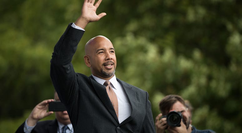 Bronx Borough President Ruben Diaz Jr. waves to the crowd as he takes the stage during an event supporting public charter schools and protesting New York's racial achievement gap in education, in Prospect Park, September 28, 2016 in Brooklyn. Ruben Diaz Jr.