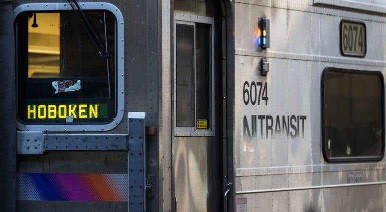A New Jersey Transit train arrives at Hoboken Terminal during morning rush hour A New Jersey Transit train arrives at Hoboken Terminal during morning rush hour