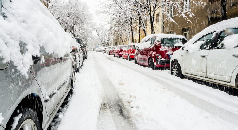 Cars on a snowy city street