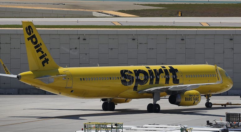 A Spirit Airlines plane is seen on the tarmac A Spirit Airlines plane is seen on the tarmac