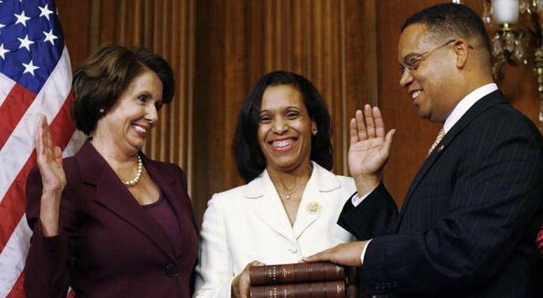 U.S. Rep. Keith Ellison (D-MN) (R) takes his oath of office by swearing on a Koran during a ceremonial swearing in with Speaker of the House Nancy Pelosi. U.S. Rep. Keith Ellison (D-MN) (R) takes his oath of office by swearing on a Koran during a ceremonial swearing in with Speaker of the House Nancy Pelosi.