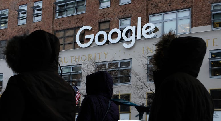 People walk past a Google office building on 9th Avenue in Chelsea district on December 30, 2017 in New York City. Google NYC