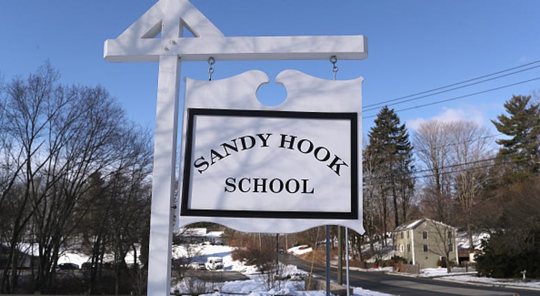 A sign stands near the site of the December 2012 Sandy Hook school shooting A sign stands near the site of the December 2012 Sandy Hook school shooting
