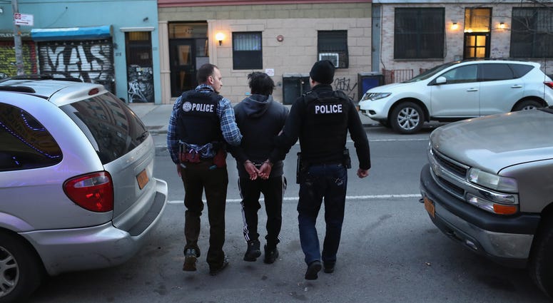 U.S. Immigration and Customs Enforcement (ICE), officers stage a raid to arrest an undocumented immigrant on April 11, 2018 in New York City. New ICE raid