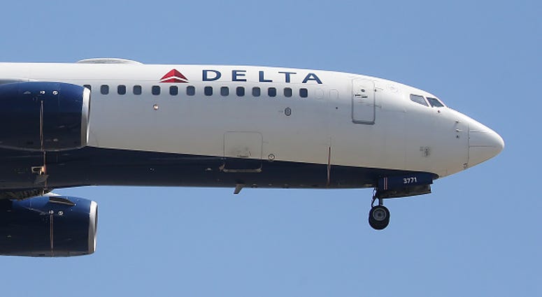 A Delta Air Lines plane lands at Los Angeles International Airport A Delta Air Lines plane lands at Los Angeles International Airport