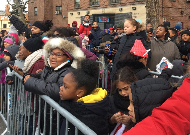 Kids come out to see Santa and his gang. Santa NYPD