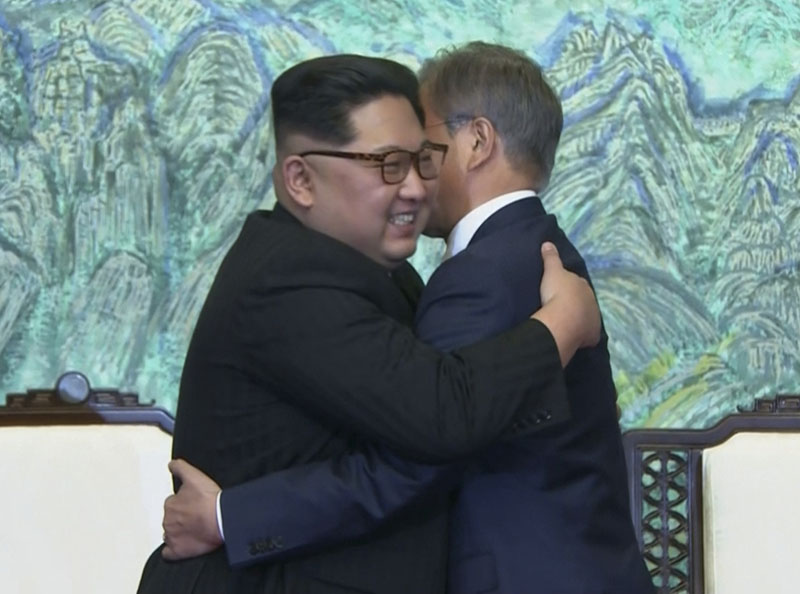 In this image made from video provided by Korea Broadcasting System (KBS), North Korean leader Kim Jong Un, left, and South Korean President Moon Jae-in embrace each other after signing on a joint statement at the border village of Panmunjom In this image made from video provided by Korea Broadcasting System (KBS), North Korean leader Kim Jong Un, left, and South Korean President Moon Jae-in embrace each other after signing on a joint statement at the border village of Panmunjom