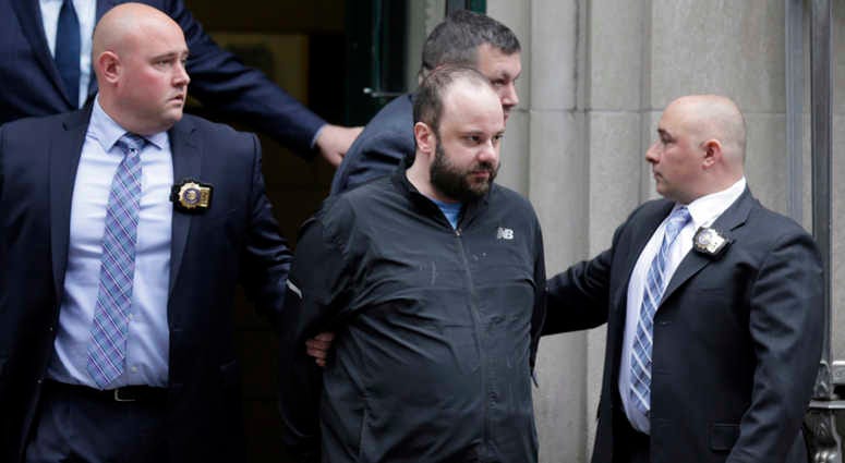 Marc Lamparello, 37, center, is escorted out of a police precinct in New York, Thursday, April 18, 2019. Marc Lamparello, 37, center, is escorted out of a police precinct in New York, Thursday, April 18, 2019.