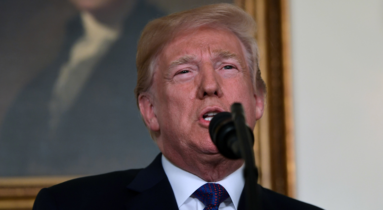 President Donald Trump speaks in the Diplomatic Reception Room of the White House on Friday, April 13, 2018, in Washington, about the United States' military response to Syria's chemical weapon attack on April 7.