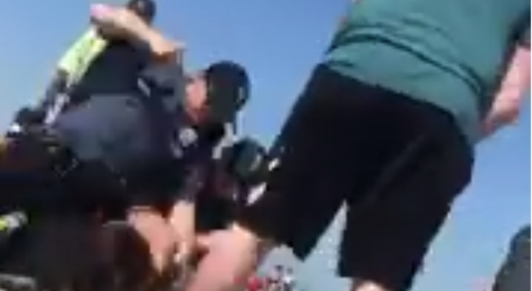 Officer seen on video punching woman on Wildwood beach @HewittLexy/Twitter