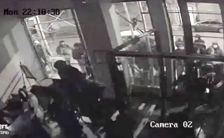 The fur store being burglarized. The fur store being burglarized