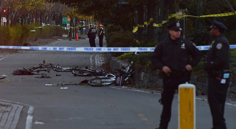 Oct 31, 2017; New York, NY, USA; Police secure the scene at a bike path at Houston Street and West Street in lower Manhattan after a motorist drove onto the path near the World Trade Center memorial, striking and killing several people. Oct 31, 2017; New York, NY, USA; Police secure the scene at a bike path at Houston Street and West Street in lower Manhattan after a motorist drove onto the path near the World Trade Center memorial, striking and killing several people.