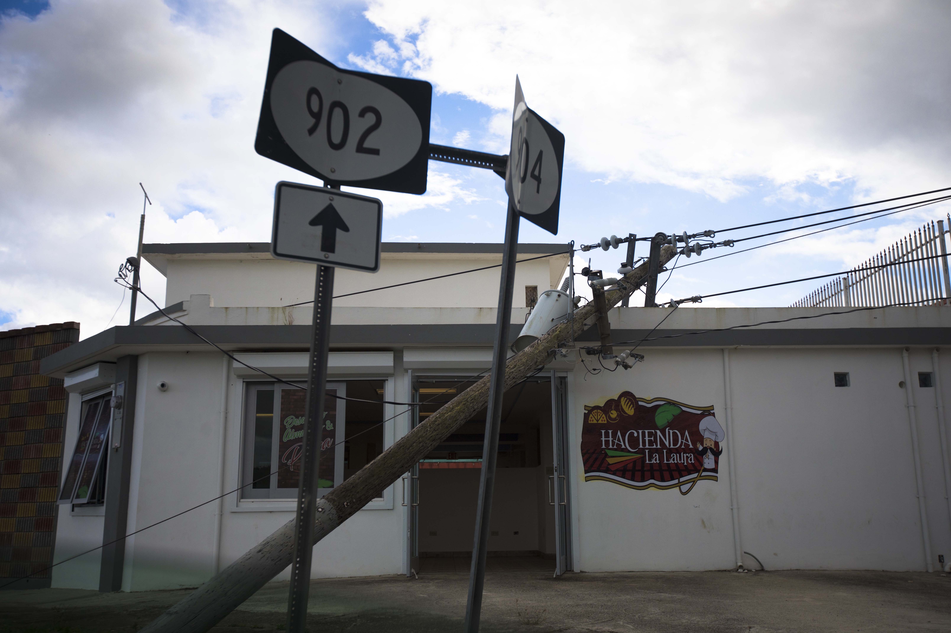 Yabucoa, Puerto Rico; Nearly six months after Hurricane Maria, an electrical pole still lies on top of a restaurant in Yabucoa, Puerto Rico. Mandatory Credit: Carrie Cochran/The Enquirer via USA TODAY NETWORK