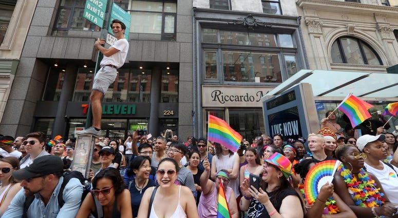 People line the streets at the NYC Pride Parade. NYC PRIDE