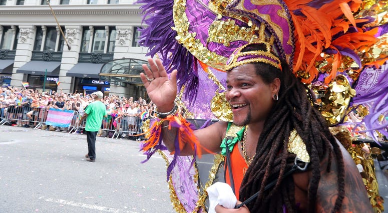 A marcher smiles at the crowd during the Pride March. NYC Pride