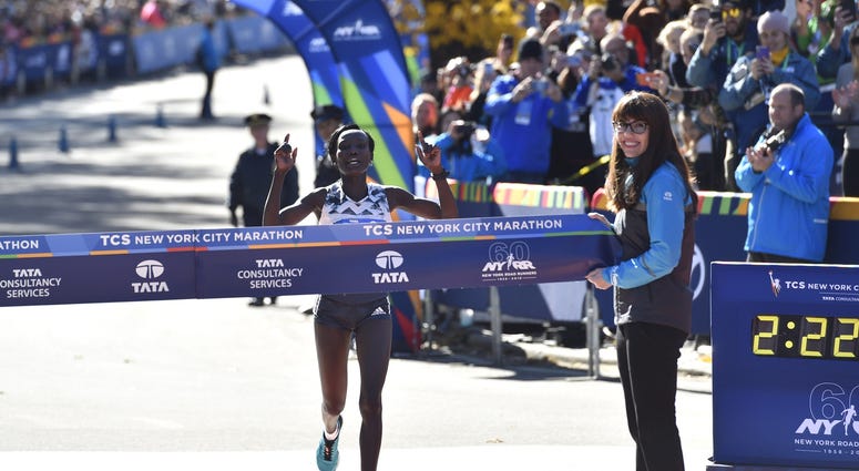 Mary Keitany crosses the finish line to win the professional women's division of the 2018 TCS New York City Marathon. NYC Marathon