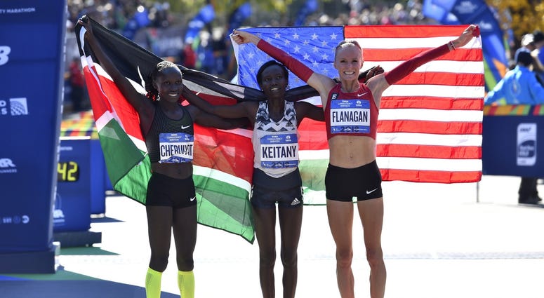 From left, Vivian Cheruiyot, Mary Keitany and Shalane Flanagan pose for a photo after the professional women's division 2018 TCS New York City Marathon. Keitany won the race. NYC Marathon