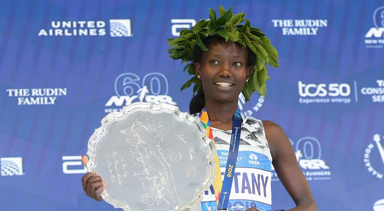 Mary Keitany of Kenya poses during the medal ceremony after winning the 2018 TSC New York City Marathon in New York, NY. NYC Marathon
