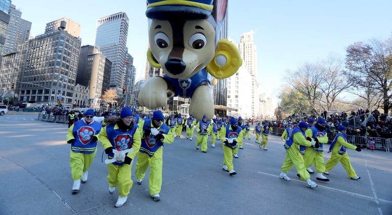 Handlers pull the Chase from Paw Patrol balloon through Columbus Circle in Manhattan during the annual Macy's Thanksgiving Day Parade Nov. 22, 2018. Thanksgiving Parade