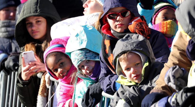 Young spectators wrapped in layers watch the annual Macy's Thanksgiving Day Parade in Manhattan Nov. 22, 2018. Thanksgiving Parade