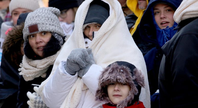Spectators wrapped themselves in layers as they watched the annual Macy's Thanksgiving Day Parade in Manhattan Nov. 22, 2018. Thanksgiving Parade