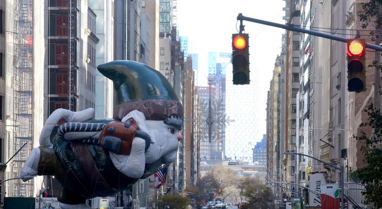 A parade balloon crosses 57th Street as it makes its way down 6th Ave. in Manhattan during the annual Macy's Thanksgiving Day Parade Nov. 22, 2018. Thanksgiving Parade
