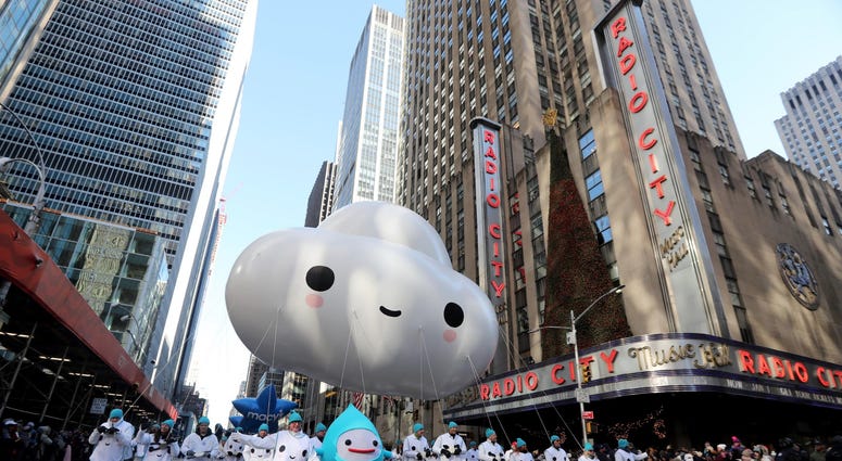 The Little Cloud balloon makes its way past Radio City Music Hall on 6th Ave. in Manhattan during the annual Macy's Thanksgiving Day Parade Nov. 22, 2018. Thanksgiving Parade