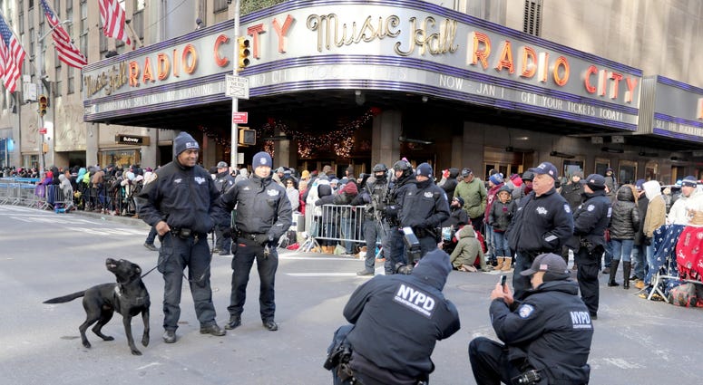 Members of the New York City Police Department pause for a photo in front of Radio City Music Hall on 6th Ave. in Manhattan during the annual Macy's Thanksgiving Day Parade Nov. 22, 2018. Thanksgiving Parade