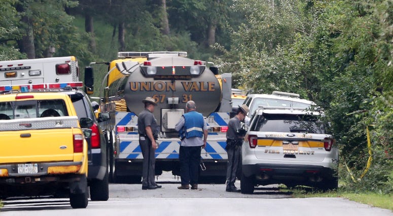 New York State police and FAA representatives continue their investigation at the scene on South Smith Road in Union Vale where a plane crashed into a house on Saturday Aug. 17, 2019. Plane crash Union Vale