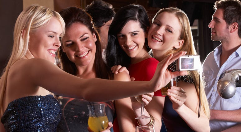 Group of women drinking at the bar. Group of women drinking at the bar.