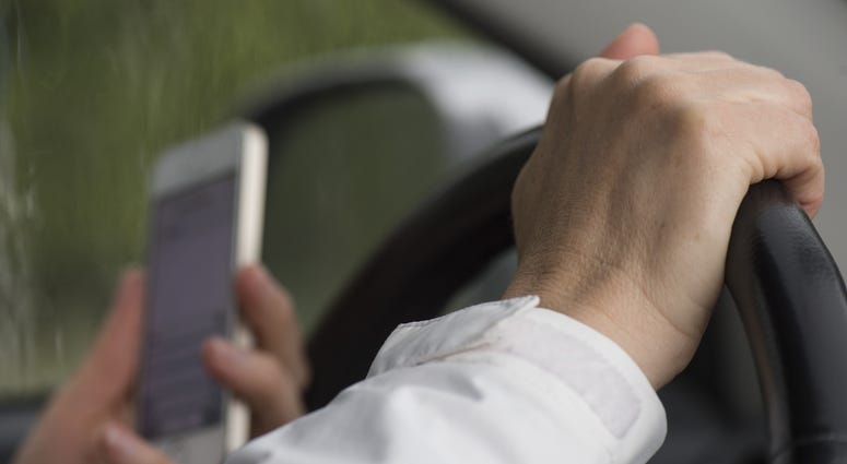 Texting and driving file image. Texting and driving file image.
