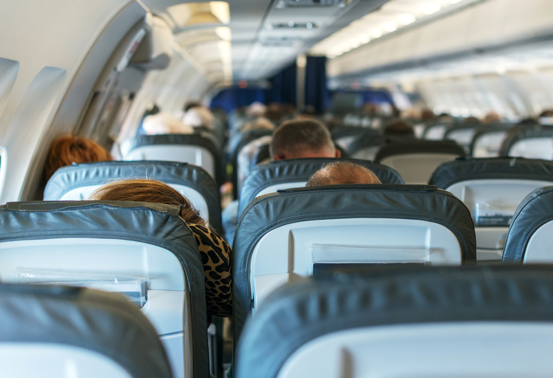 Inside of the plane with passengers. Inside of the plane with passengers.