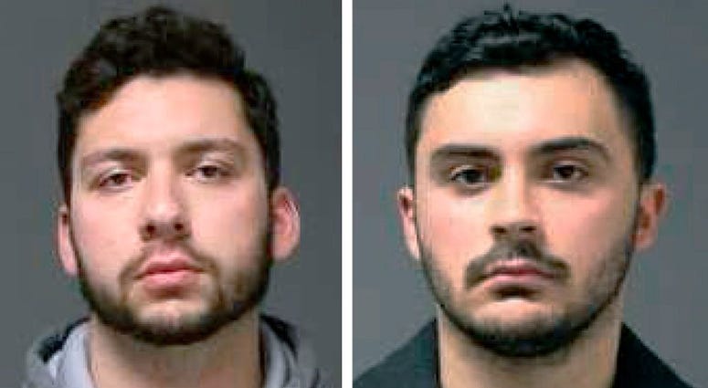 These 2019 file booking photos provided by the University of Connecticut Police Department show UConn students Jarred Mitchell Karal, left, and Ryan Mucaj, who were arrested in 2019 for shouting a racial slur outside a campus apartment complex. UConn students Jarred Mitchell Karal, left, and Ryan Mucaj