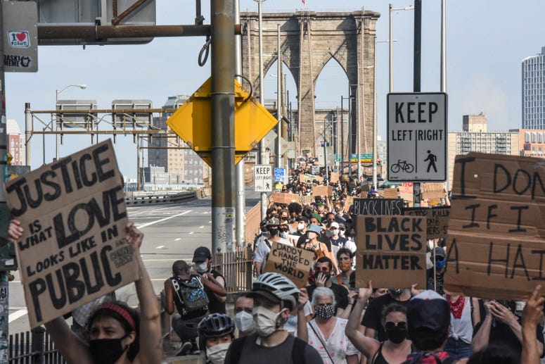 Demonstrators march over the Brooklyn Bridge into Manhattan in support of the Black Lives Matter movement on June 6, 2020 in New York City. nyc protest