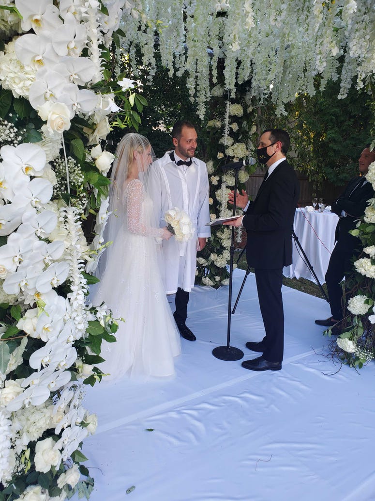 Ashley and Israel are married in the backyard ceremony. Ashley and Israel