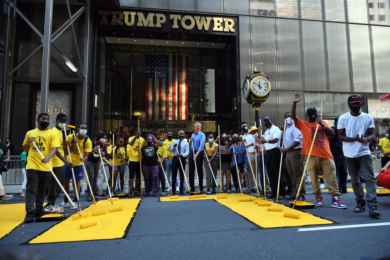 Mayor de Blasio helps paint the mural outside Trump Tower. BLM mural Trump Tower