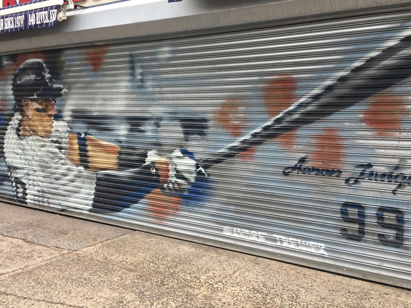 Murals painted on businesses outside of Yankee stadium by André Trenier Murals painted on businesses outside of Yankee stadium by André Trenier