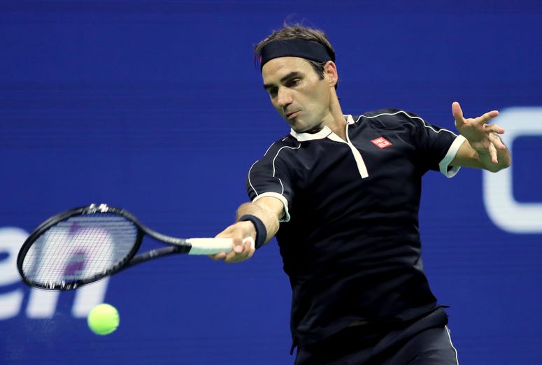 Roger Federer of Switzerland returns a shot during his Men's Singles quarterfinal match against Grigor Dimitrov of Bulgaria on day nine of the 2019 US Open (Elsa/Getty Images)